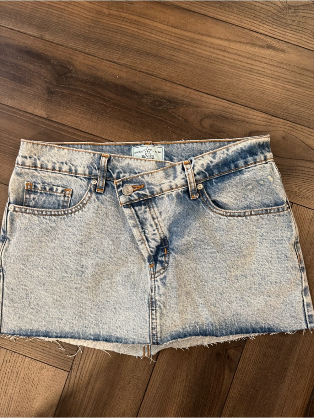 REVICE Light Blue Denim Mini Skirt with Raw Hem